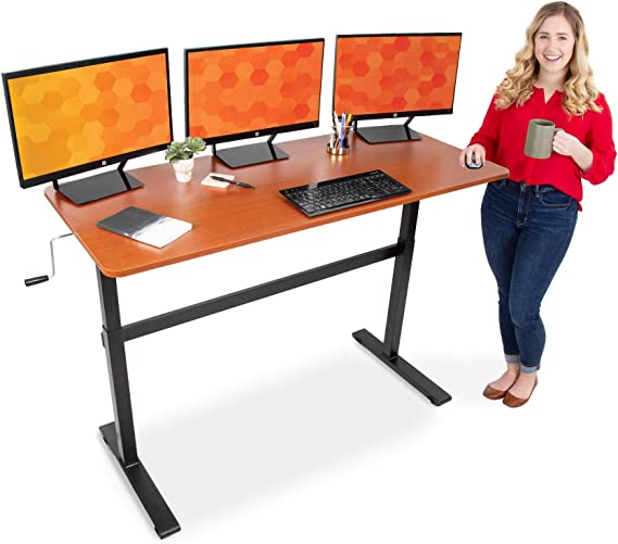 Photo 1 of Stand Steady Tranzendesk 55 Inch Standing Desk | Easy Crank Manual Height Adjustable Sit to Stand Workstation | Modern Ergonomic Desk Supports 3 Monitors | Perfect for Home & Office! (55 / Cherry)
