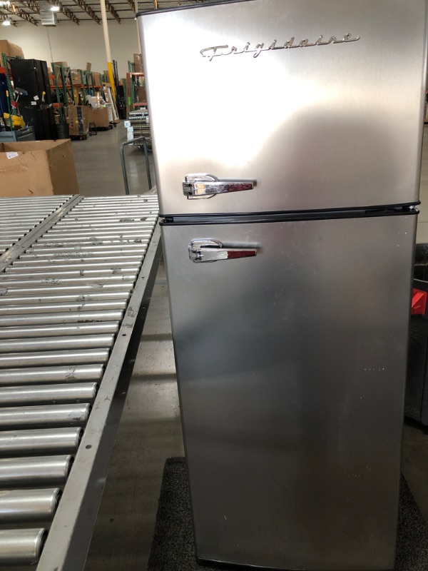 Photo 6 of ***DAMAGED** Frigidaire 7.2 Cu. Ft. Top Freezer Stainless Steel Apartment Size Refrigerator
