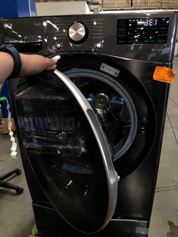 Photo 1 of LG - 4.5 Cu. Ft. High Efficiency Stackable Smart Front-Load Washer with Steam and Built-In Intelligence - Black steel with LG - 27" Laundry Pedestal with Storage Drawer - Black steel

