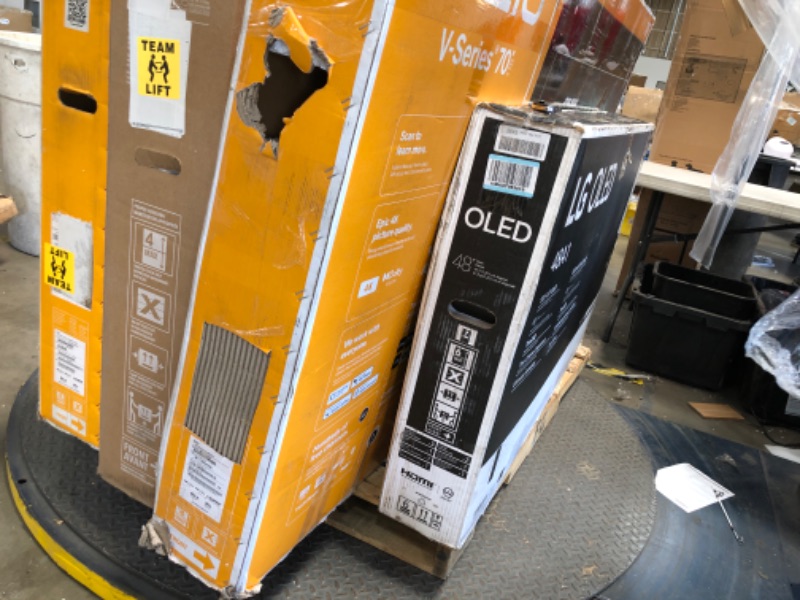 Photo 6 of Nonrefundable -sold as -Pallet of 5 broken, nonfunctional , damaged Tv's and monitors, different sizes and models . 
2 tvs are 65" /48" / 70" / 27"