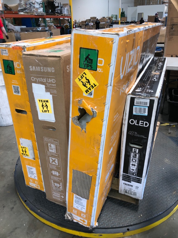 Photo 1 of Nonrefundable -sold as -Pallet of 5 broken, nonfunctional , damaged Tv's and monitors, different sizes and models . 
2 tvs are 65" /48" / 70" / 27"