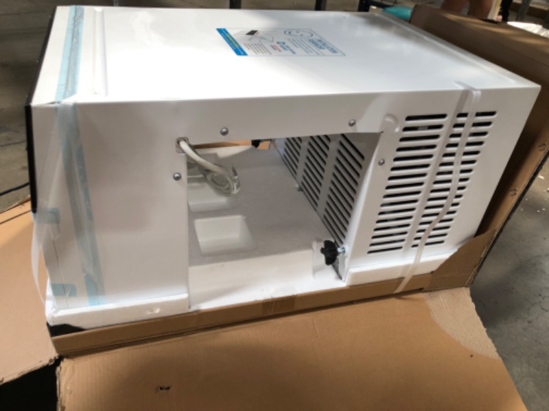 Photo 1 of Exclusive 6,000 BTU Energy Star First Ever Over the Sill Air Conditioner  Hybrid (Saddle) Window Air Conditioner with Wifi

