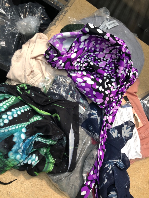 Photo 1 of BUNDLE OF ASSORTED CLOTHING- VARIOUS SIZES, BIKINIS, SHIRTS 