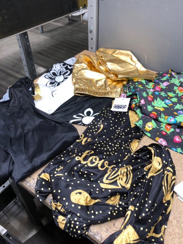 Photo 1 of ASSORTED WOMENS CLOTHING, NONREFUNDABLE, 2 DRESSES, ONE PJ JUMP SUIT, SCRUB TOP, AND GOLD LEGGINGS 