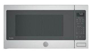 Photo 1 of Profile 2.2 cu. ft. Countertop Microwave in Stainless Steel with Sensor Cooking
MINOR DENTS 
