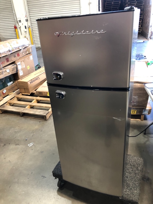 Photo 1 of PARTS ONLY NOT FUNCTIONAL NON REFUNDABLE 
Frigidaire EFR751, 2 Door Apartment Size Refrigerator with Freezer, 7.2 cu ft, Platinum Series, Stainless Steel, 7.5