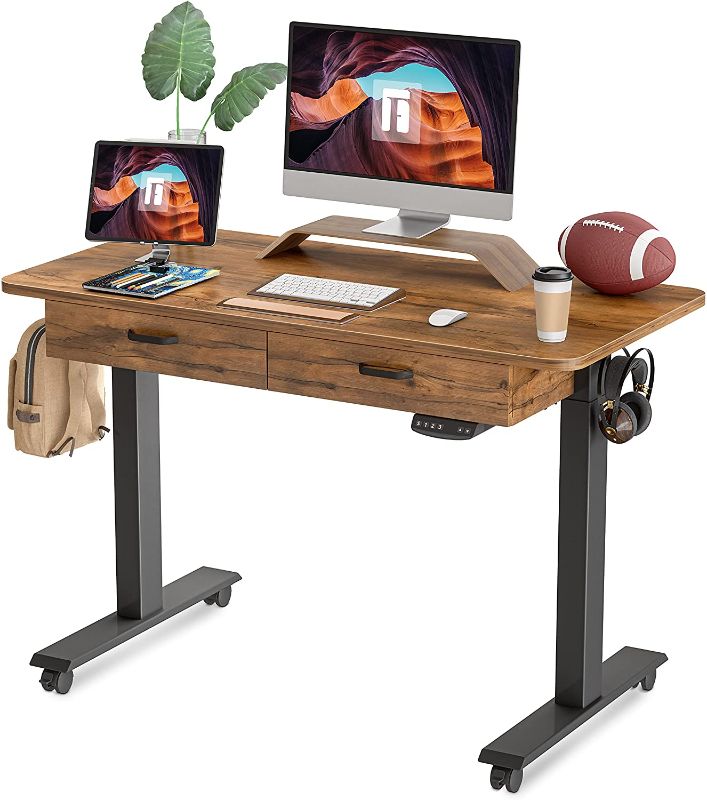 Photo 1 of FEZIBO Standing Desk with Double Drawer, 48x 24 Inches Adjustable Height Electric Stand up Desk, Ergonomic Workstation Black Frame/Fir Brown Top
