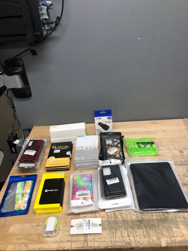 Photo 1 of Bundle of cell phone cases, screen protectors, phone holders, car charger, and tablet case
assorted varieties for LG's, Samsung, Apple I-phone and I-pad