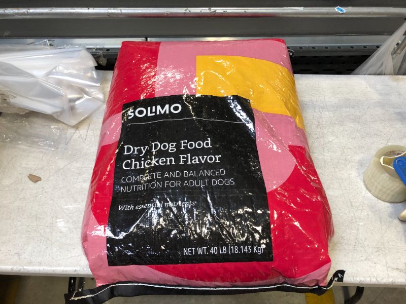 Photo 2 of Amazon Brand - Solimo Basic Dry Dog Food with Grains (Chicken Flavor) -- Best By NOV 2021