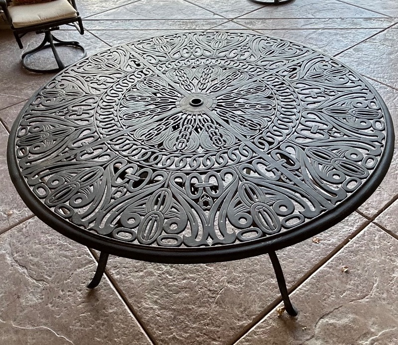 Photo 2 of HEAVY WROUGHT IRON PATIO TABLE 50” X 30”  (4 CHAIRS WITH CUSHIONS SOLD SEPERATELY)