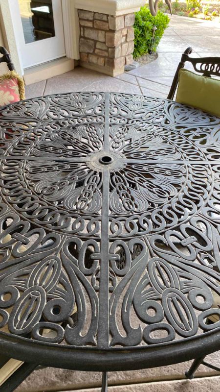 Photo 5 of HEAVY WROUGHT IRON PATIO TABLE 50” X 30”  (4 CHAIRS WITH CUSHIONS SOLD SEPERATELY)