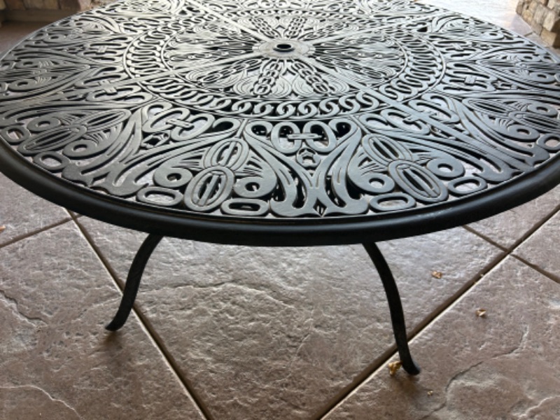 Photo 3 of HEAVY WROUGHT IRON PATIO TABLE 50” X 30”  (4 CHAIRS WITH CUSHIONS SOLD SEPERATELY)