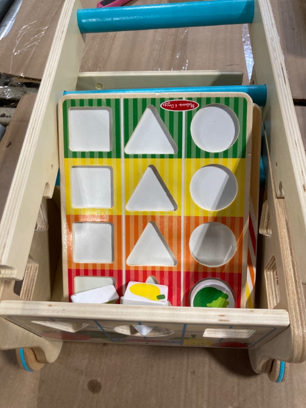 Photo 1 of *** missing items*** Melissa & Doug Wooden Shape Sorting Grocery Cart Push Toy and Puzzles (16 Pieces)