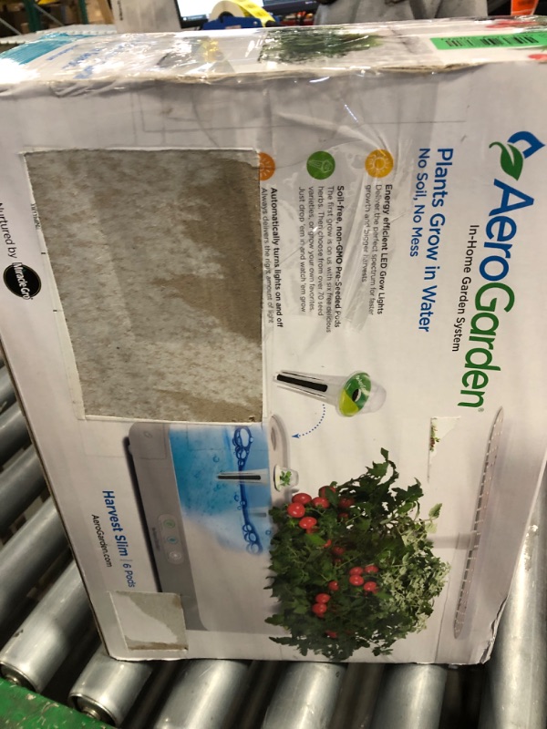 Photo 1 of AeroGarden Harvest Slim Indoor Garden Hydroponic System with LED Grow Light and Herb Kit, Holds Up to 6 Pods, Black