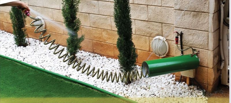 Photo 1 of 25 FOOT SPIRAL HOSE WITH CANISTER CONNECTS TO WALL WHEN DONE STAND UP RIGHT NEW
