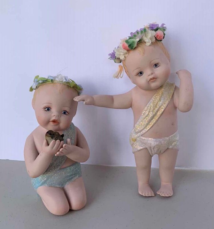 Photo 1 of TWO HANDPAINTED PORCELAIN BABIES, (STANDING BABY IS NUMBERED) , H 7”