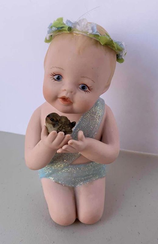 Photo 2 of TWO HANDPAINTED PORCELAIN BABIES, (STANDING BABY IS NUMBERED) , H 7”