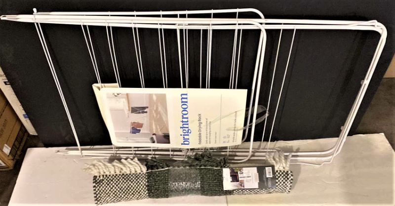 Photo 1 of BRIGHTROOM FOLDABLE DRYING RACK AND GRAY AND WHITE RUG 25” X 38”