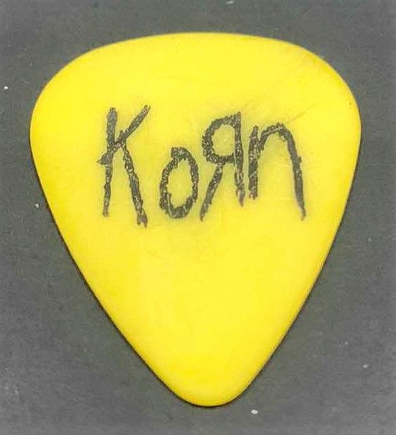 Photo 2 of COLLECTIBLE MEMORABILIA SIGNED GUITAR PICK, KORN LIFE IS PEACHY