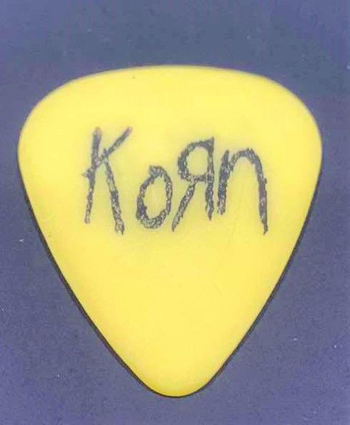 Photo 2 of COLLECTIBLE MEMORABILIA SIGNED GUITAR PICK, KORN LIFE IS PEACHY