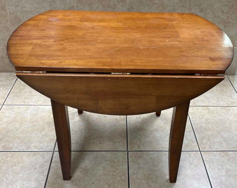 Photo 1 of WOOD DROP LEAF TABLE FULLY EXTENDED 42” X H30”, NOT EXTENDED 42” X 28” H30”