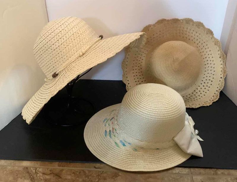 Photo 1 of THREE LADIES STRAW HATS WITH STAND