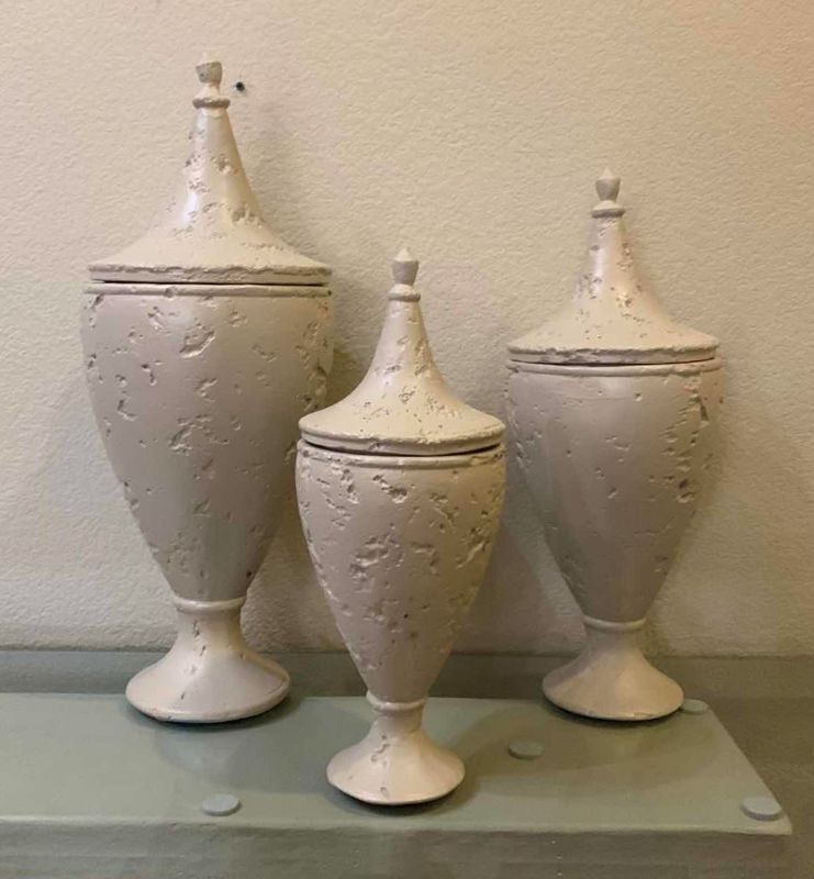 Photo 1 of SET OF 3 OFF WHITE PLASTER URNS W LIDS, TALLEST H23”