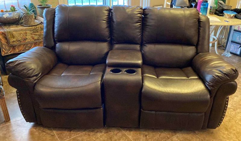 Photo 1 of BONDED LEATHER MANUAL RECLINING LOVESEAT WITH CONSOLE 74” (ONE SEAT RECLINES)