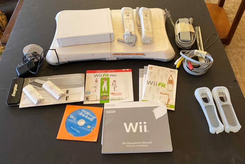 Photo 1 of Wii FIT PLUS WITH WII, 2 CONTROLERS AND ENERGIZER CHARGING STATION