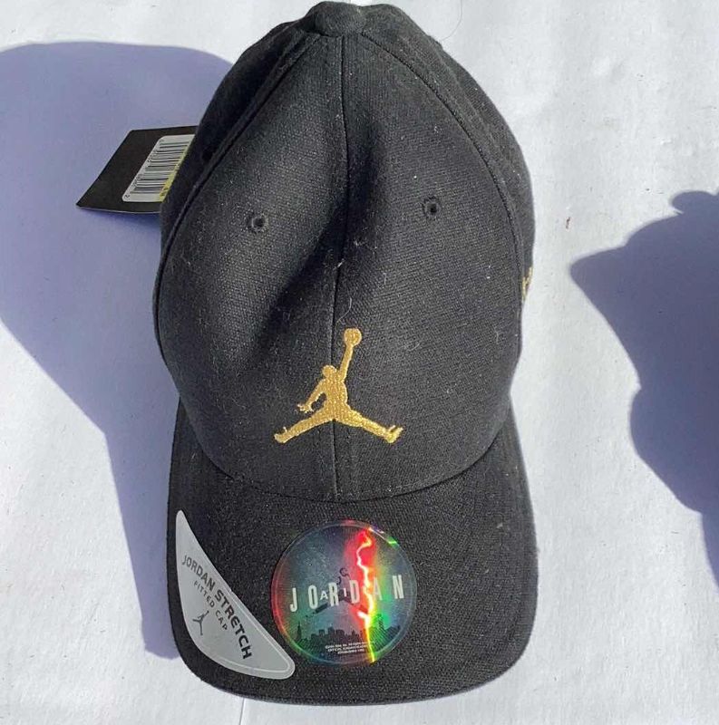 Photo 2 of 3 - MIRAGE CASINO MEMORBILIA: BAG, CAP AND MICHAEL JORDAN CAP