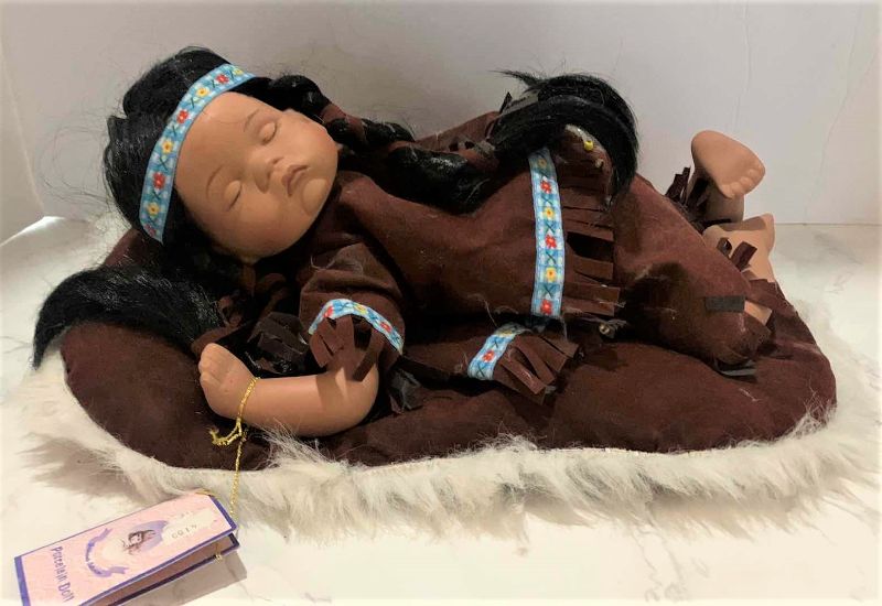 Photo 1 of COLLECTIBLE PORCELAIN INDIAN BABY DOLL w COA 12”
