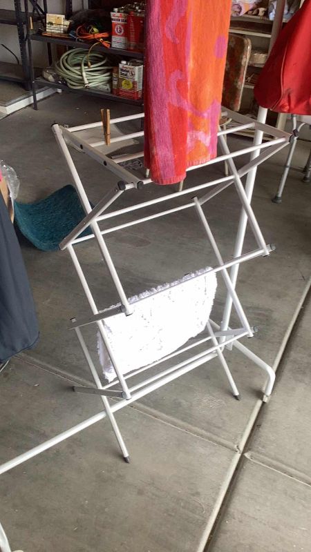Photo 1 of CLOTHING RACKS