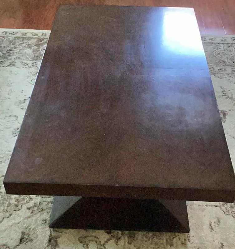 Photo 1 of LIVING ROOM TABLE WITH ROLLERS ON BOTTOM 48” X 28” H 20”