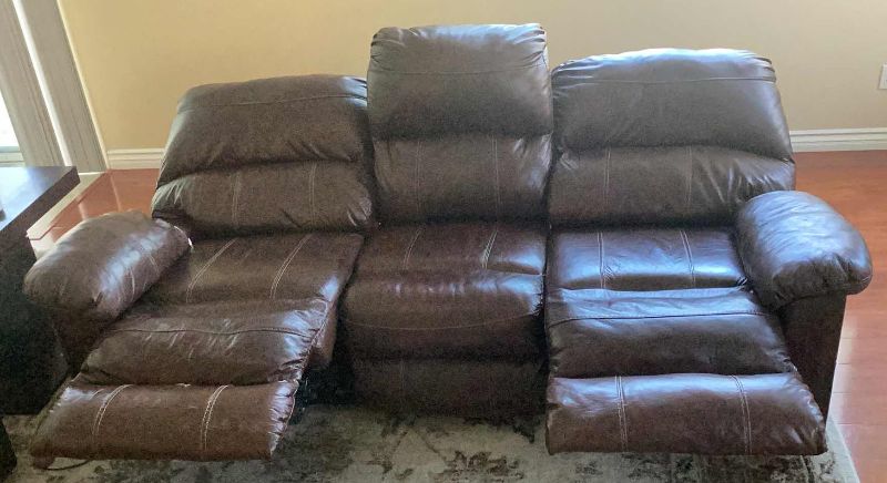 Photo 2 of LEATHER ELECTRIC DOUBLE RECLINER SOFA 88” X 43” H 40”