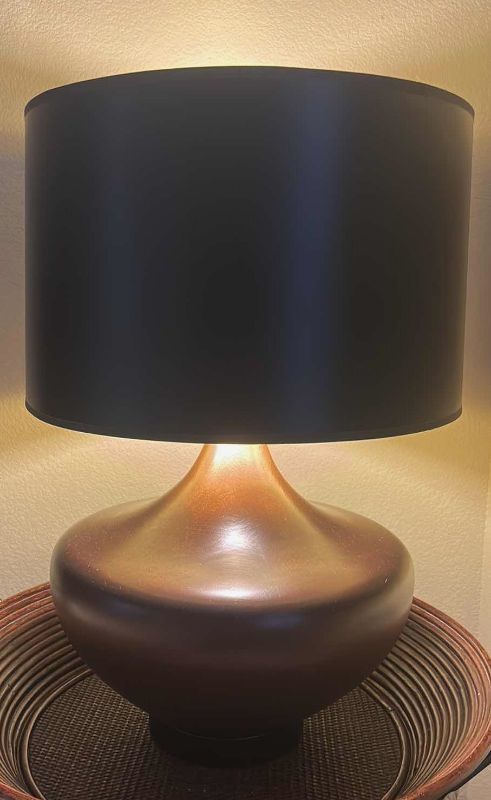 Photo 1 of BROWN AND AMBER CERAMIC TABLE LAMP W / BLACK SHADE H 26"