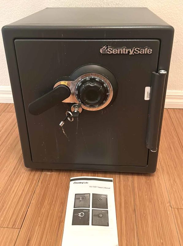 Photo 1 of SENTRY SAFE WITH KEY AND OWNERS MANUAL 16” x 20” H18”