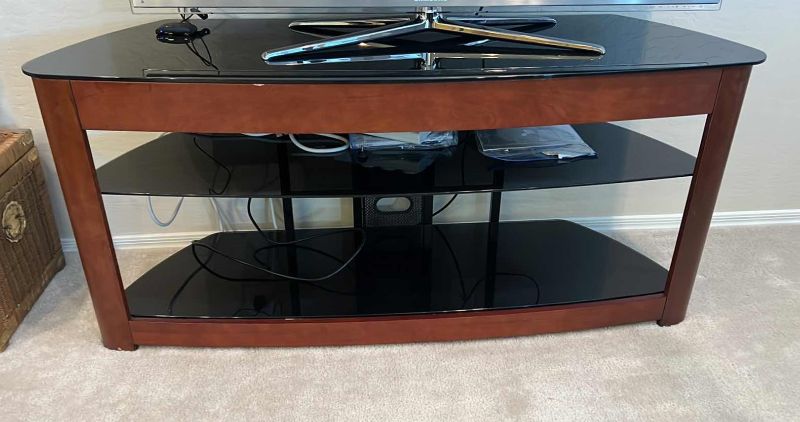 Photo 1 of HOMESTAR BLACK GLASS W WOOD ENTERTAINMENT CENTER 60” x 19” H27” (TV SOLD SEPARATELY)