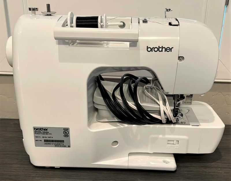 Photo 1 of BROTHER SEWING MACHINE WITH MANUAL AND LOTS OF ACCESSORIES (SEE PHOTOS)