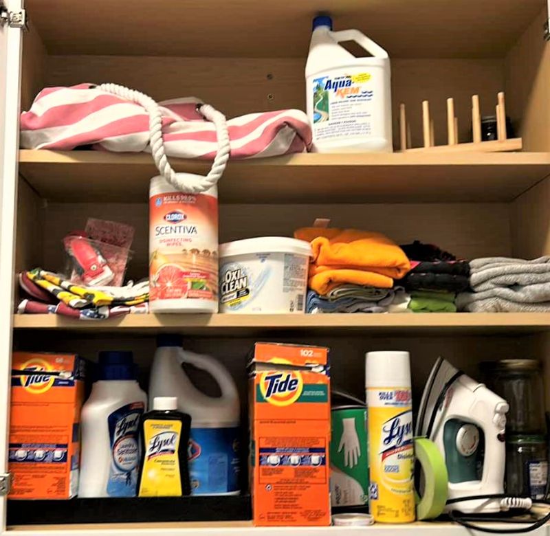 Photo 1 of CONTENTS OF CABINET IN LAUNDRY ROOM AND TOTE OF JARS