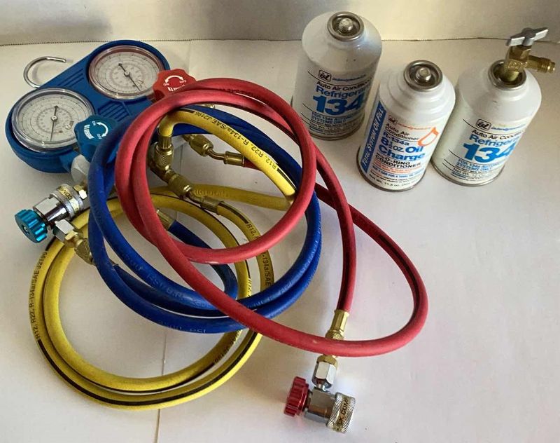 Photo 1 of AUTOMOBILE AIR CONDITIONER CHARGING CABLES, REFRIGERANT, AND OIL CHARGE