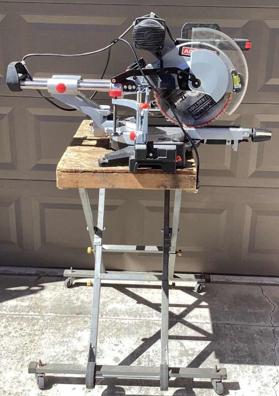 Photo 1 of ADMIRAL 12” DUAL-BEVEL SLIDING COMPOUND MITRE SAW ON ROLLING STAND