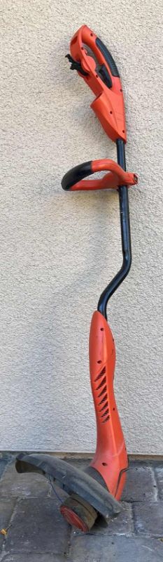 Photo 1 of ELECTRIC WEED/GRASS TRIMMER GRASSHOG BLACK AND DECKER 14” X H 49”