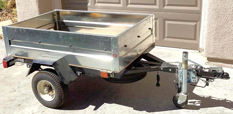 Photo 1 of HAUL-MASTER CARGO BOX TRAILER 55” X 35” HOLD UP TO 1000 POUNDS. INCLUDES, SAFTEY CHAIR, TAIL LIGHT WITH WIRING HARNESS, AND TWO WHEELS . D.O.T. CERTIFIED. TITLE IN HAND