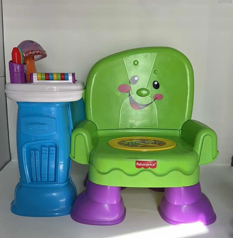 Photo 1 of BABY TOYS. FISHER-PRICE MUSICAL TODDLER/BABY PLAY CHAIR/DESK. 16” X 16”H.