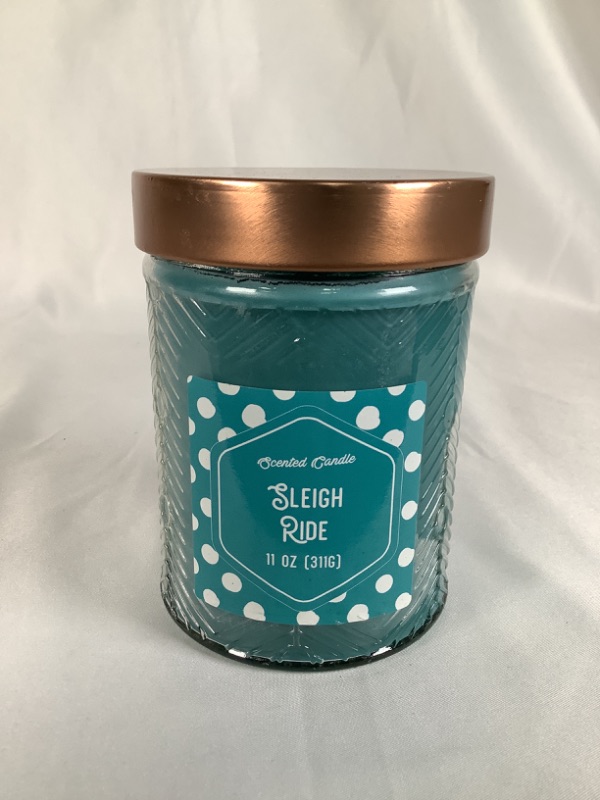Photo 1 of SLEIGH RIDE SCENTED11 OZ TEXTURED GLASS JAR CANDLE NEW