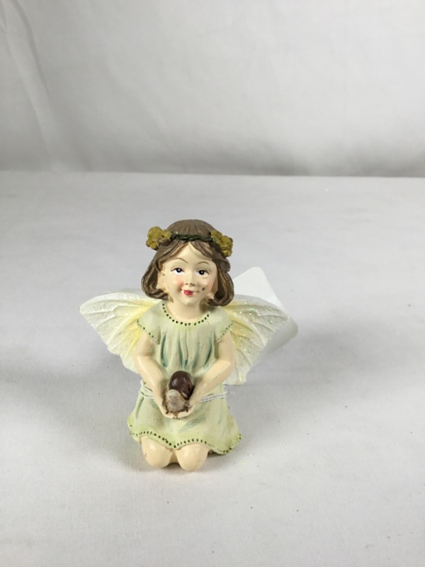 Photo 1 of YELLOW MINI RESIN SITTING GARDEN FAIRY NEW