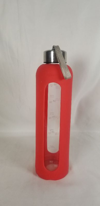 Photo 1 of 32OZ GLASS WATER BOTTLE RED SILICONE COVER METAL CAP WITH HANDLE, WATER BOTTLE HAS TIME MARKINGS ALONG THE SIDE TO REMIND YOU TO DRINK ENOUGH WATER USED 