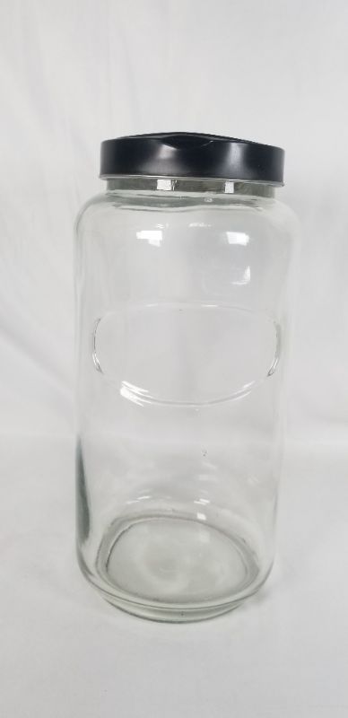 Photo 1 of CLEAR THICK GLASS JAR WITH BLACK METAL LID USED 