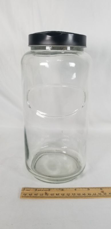 Photo 3 of CLEAR THICK GLASS JAR WITH BLACK METAL LID USED 