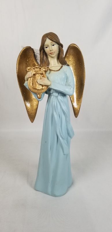 Photo 1 of BABY BLUE DRESS RESIN ANGLE WITH GOLD WINGS PLAYING A GOLD INSTRUMENT 4.5W X 10H INCHES
